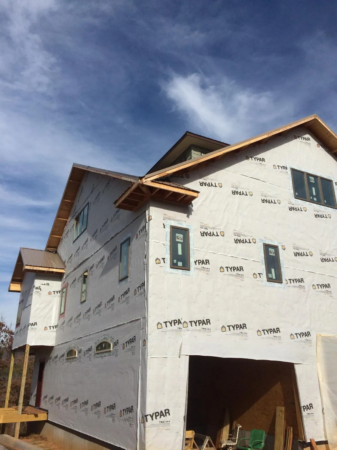 Stick built house wrapped in Typar with new roof framing and dormers in White Lake